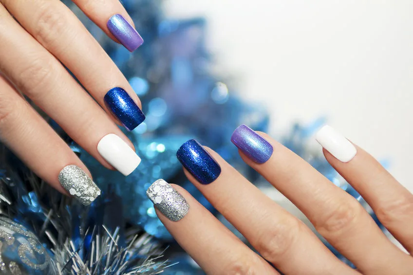 christmas blue and silver with white nail polish manicure.