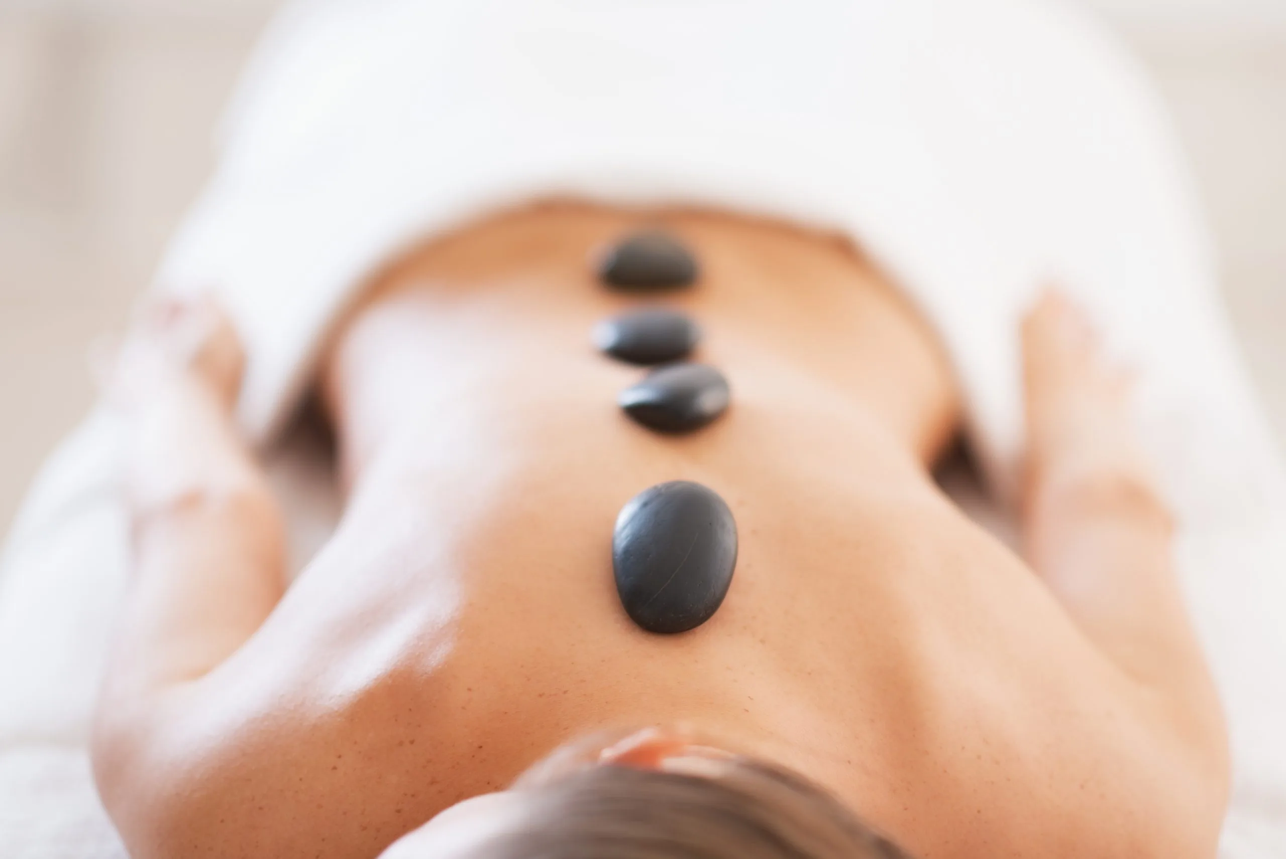 Avoid the Cold: Treat Yourself to a Hot Stone Massage